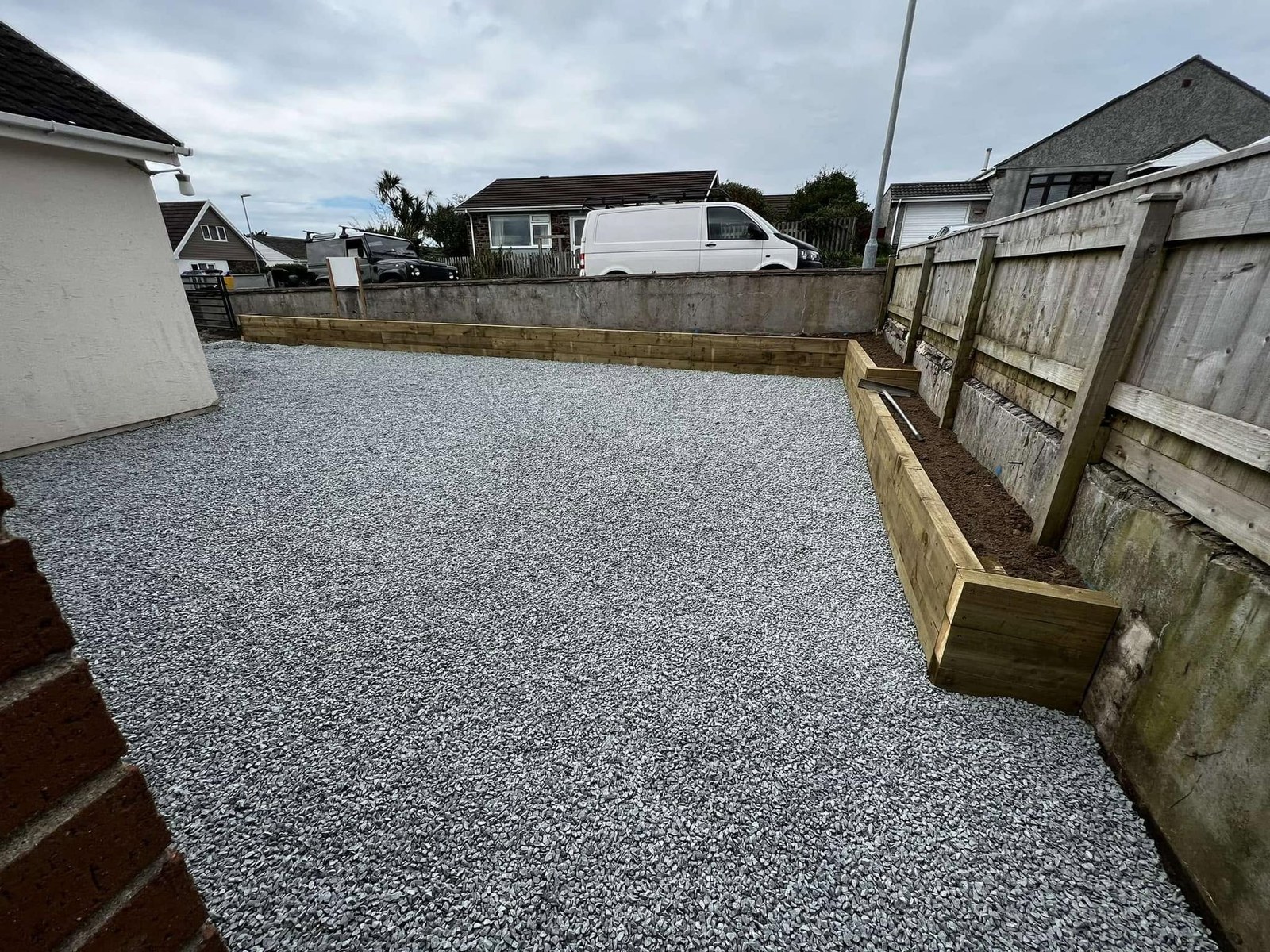 Finished gravel garden with paving and timber boundary fencing