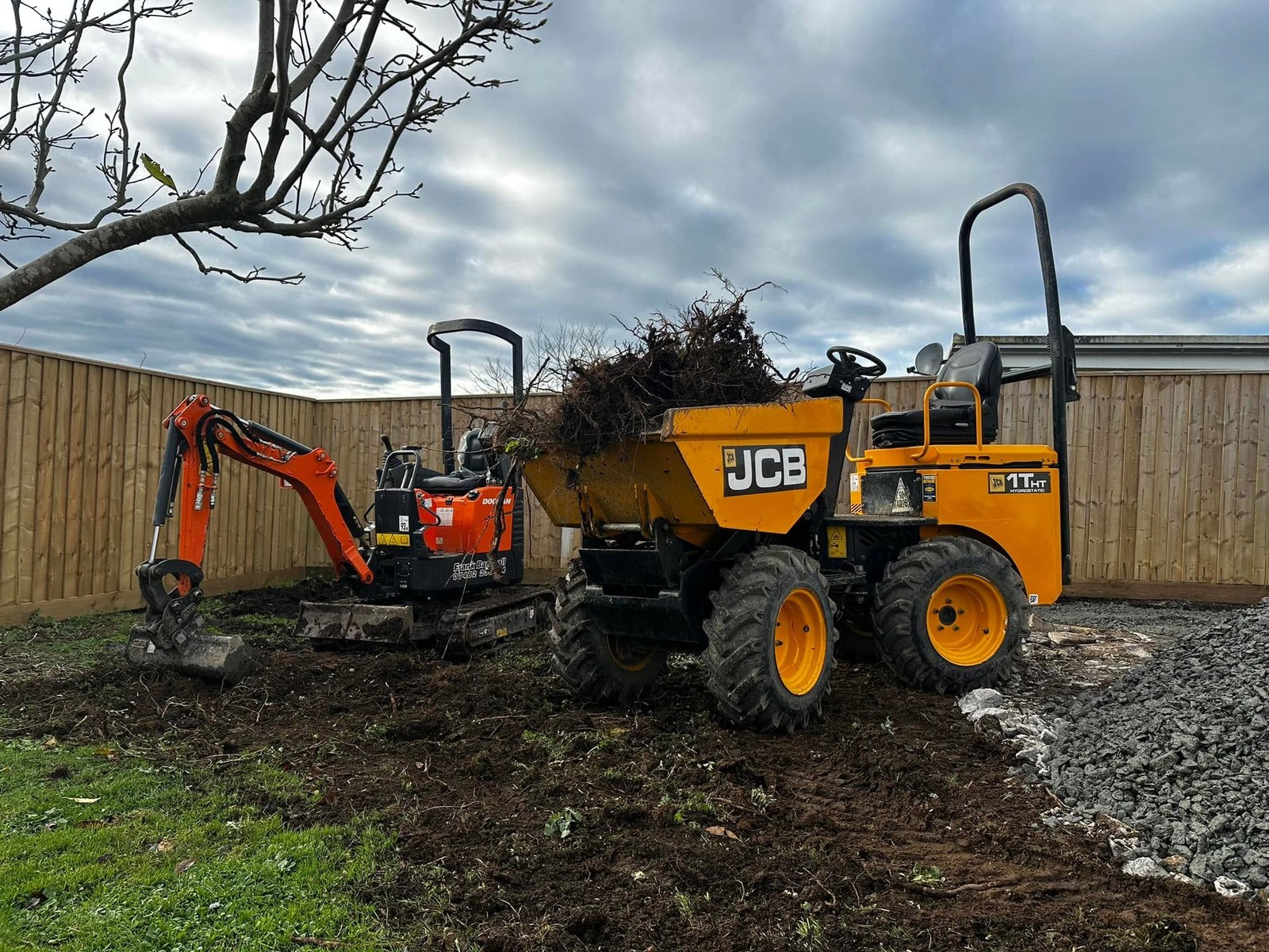 Excavator at work on a rural groundwork site